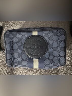 The Coach Outlet Dempsey Boxy Cosmetic Case 20 in signature jacquard